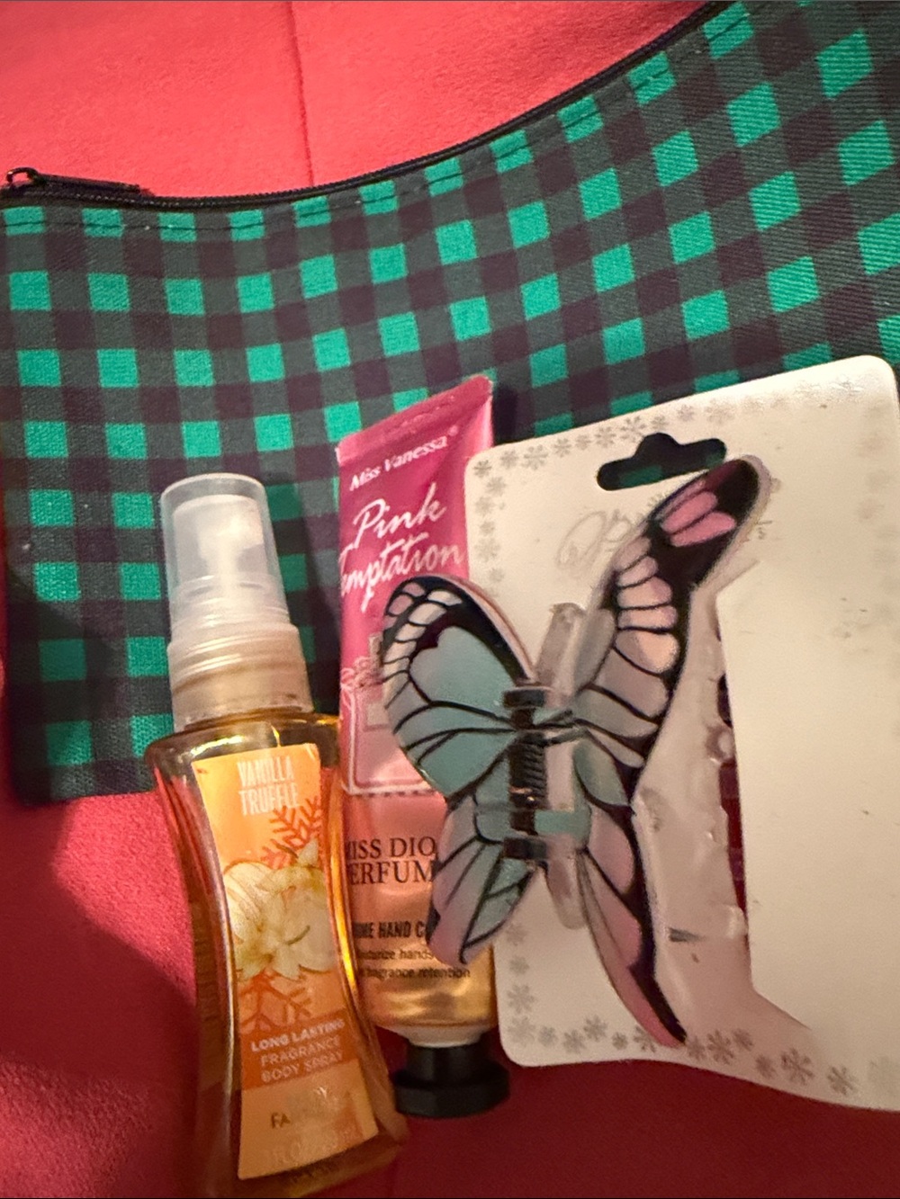 Green and black plaid makeup bag filled